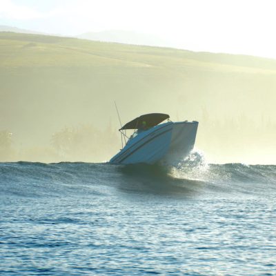 a man riding a wave on top of a body of water