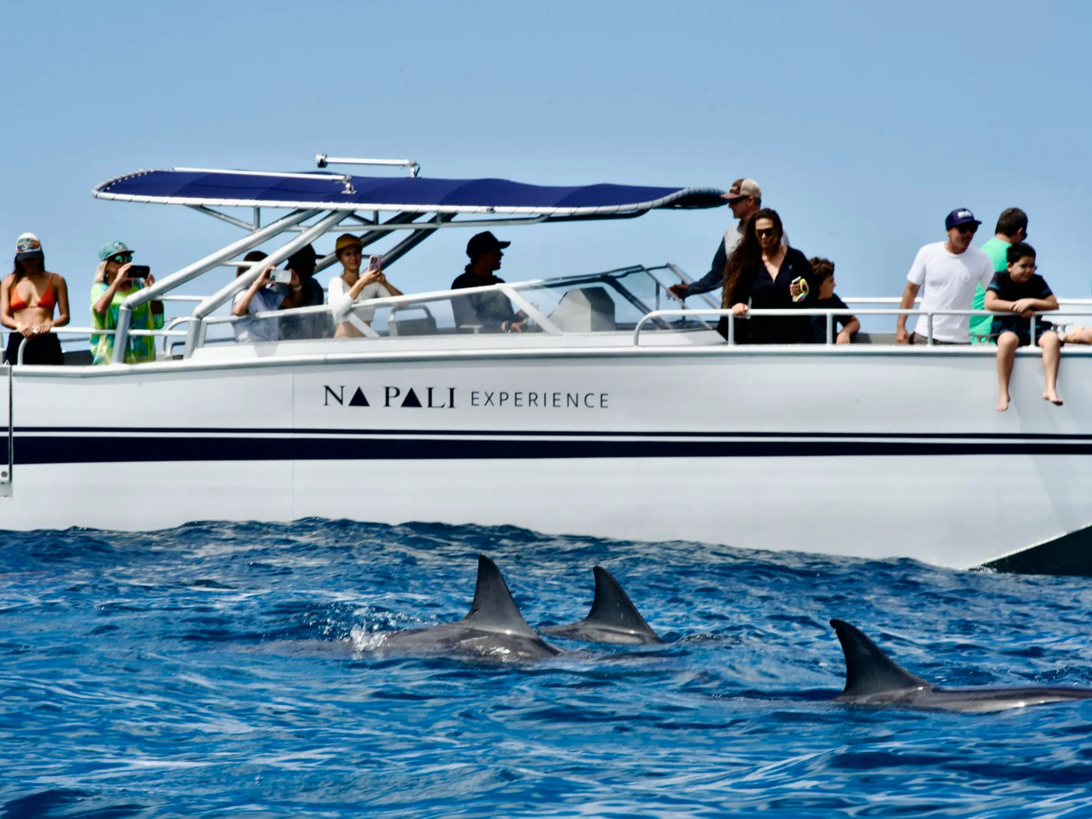 a group of people on a boat in the water