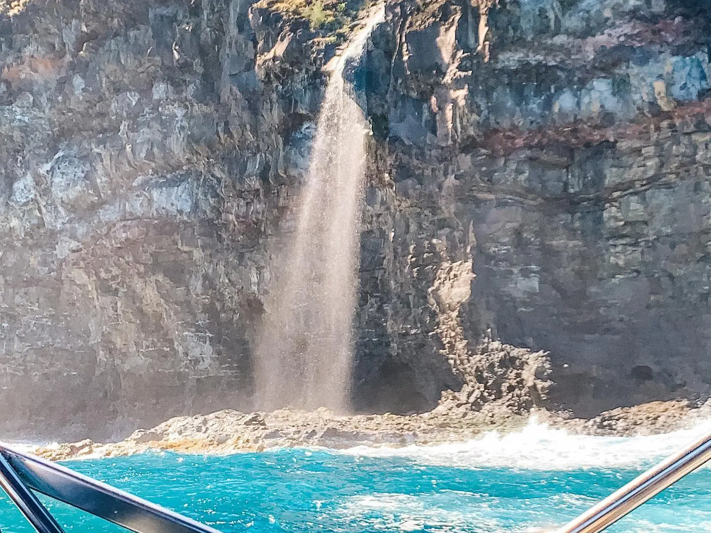 a body of water with a mountain in the background