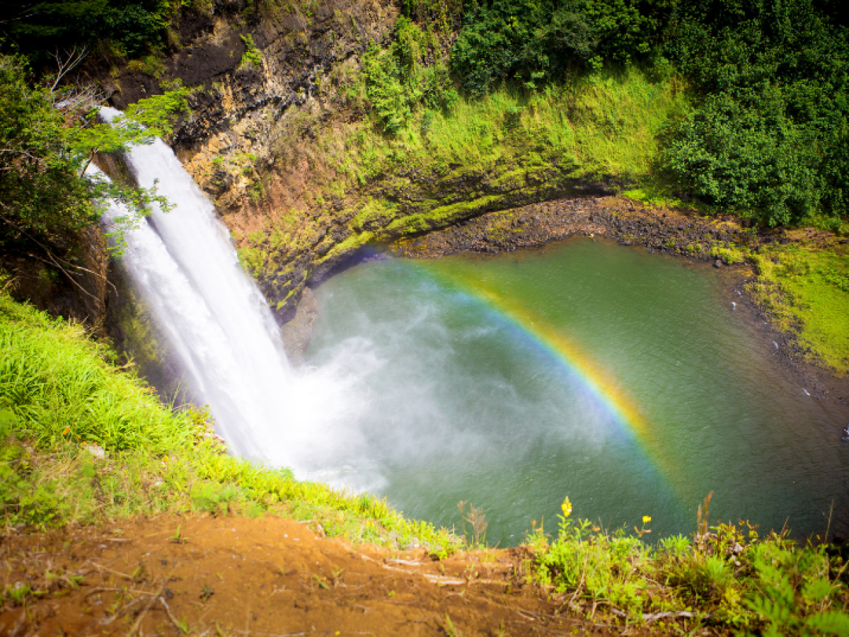 a large waterfall over a river