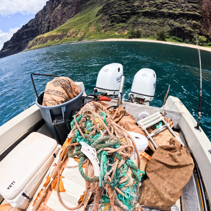 a boat that is sitting on the side of a mountain
