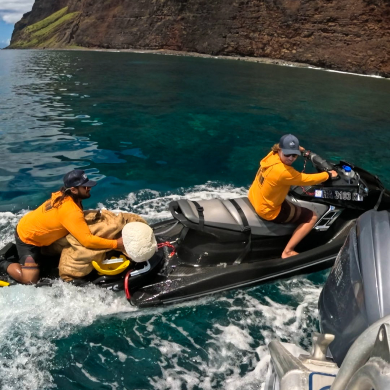 a man riding on a raft in a body of water