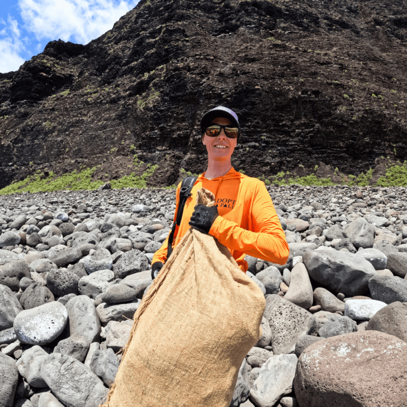 a man standing on a rocky hill