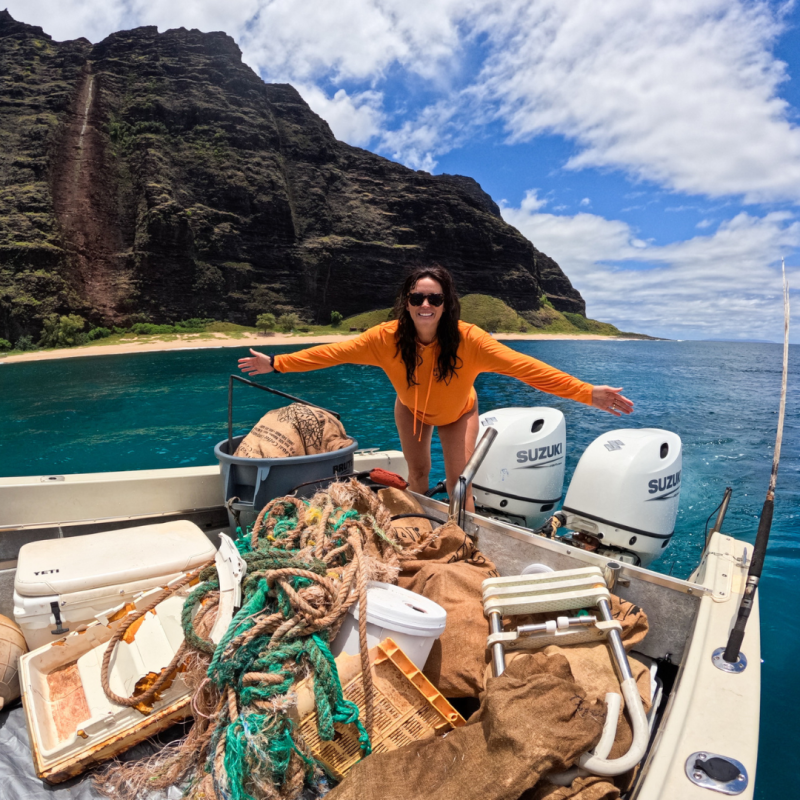 a person sitting on top of a mountain